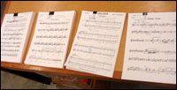 Participants tune up their scores at JoAnne Kane Music, a mechanics shop of music.