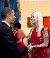 President Obama shakes hands with Michaele Salahi.