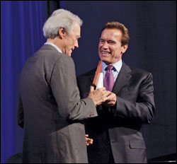 Arnold Schwarzenegger presents the museum’s award to Clint Eastwood.