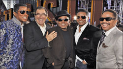Director Kenny Ortega, second from the left, with the four Jackson brothers at the L.A. premiere.