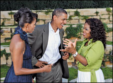 Barack Obama (center), wife Michelle (left) and Oprah Winfrey