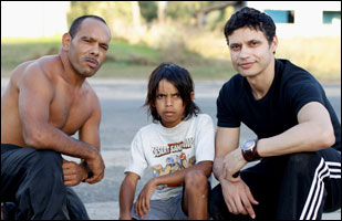 Actors Christopher Edwards and Daniel Connors pose with director Ivan Sen on location.