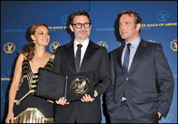 Helmer Michel Hazanavicius accepts the DGA feature award for “The Artist,” flanked by co-stars Berenice Bejo and Jean Dujardin.