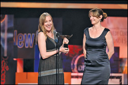Kelly Duane de la Vega, left, and Katie Galloway accept the WGA documentary award for “Better This World” in Hollywood.