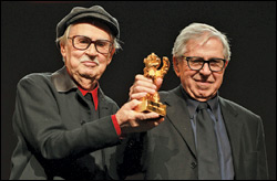Italian directors Vittorio and Paolo Taviani show off the Golden Bear they received for “Caesar Must Die” at the Berlinale awards gala. 