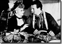 Claire Trevor and John Wayne