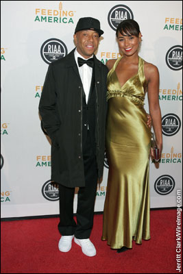 Russell Simmons and Katie Rost attend the RIAA and Feeding America Inauguration Charity Ball at Ibiza in Washington, D.C. -- January 20, 2009