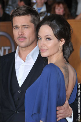 Brad Pitt and Angelina Jolie arrive at the Shrine Auditorium in Los Angeles.