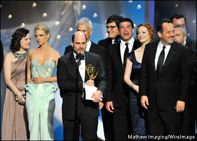 Writer Matthew Weiner (C) and 'Mad Men' cast and crew accept their best drama series Emmy.