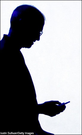 2007: Steve Jobs is silhouetted by a video screen as he shows a new iPod video during an Apple Special event.